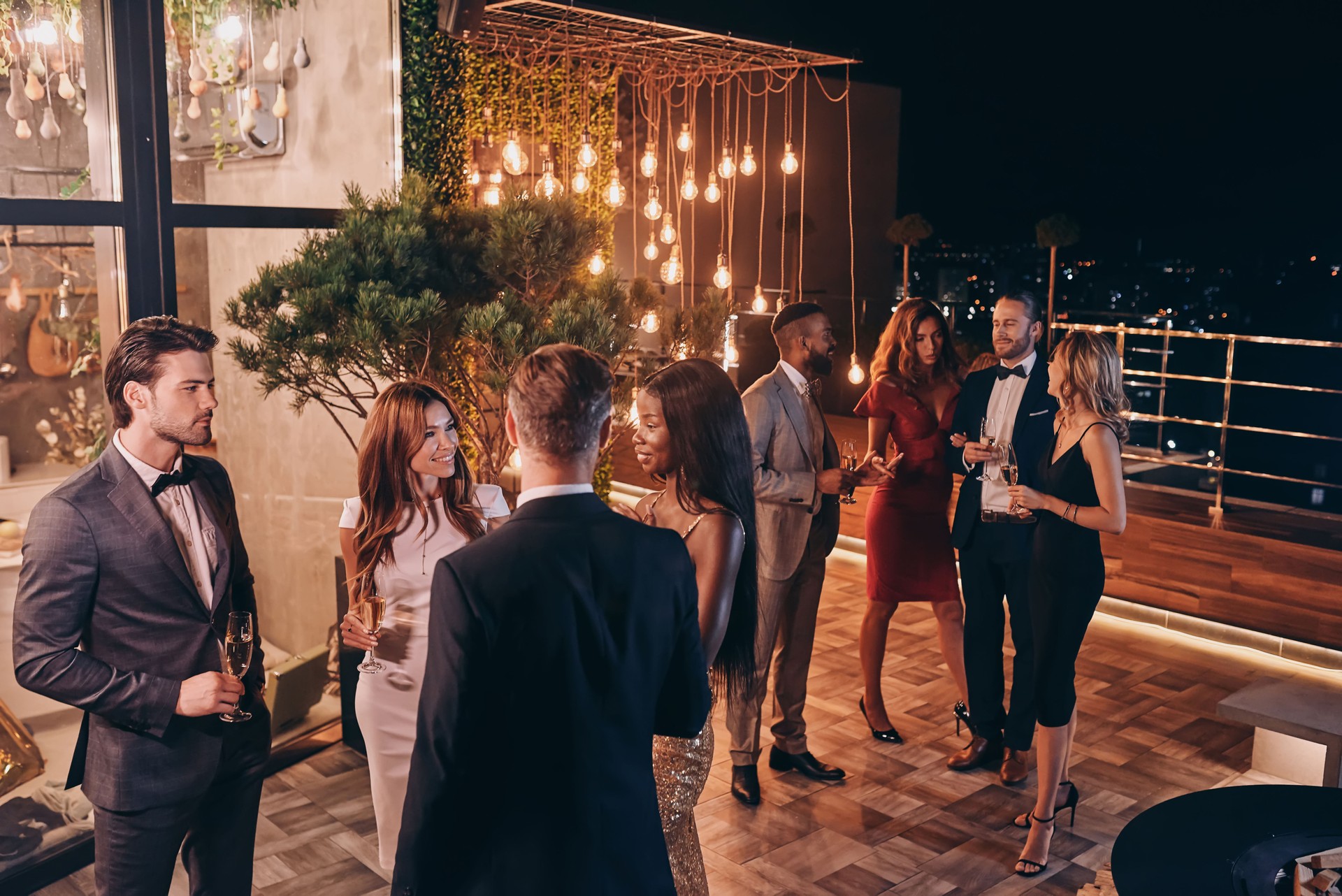 Group of people in formalwear communicating and smiling