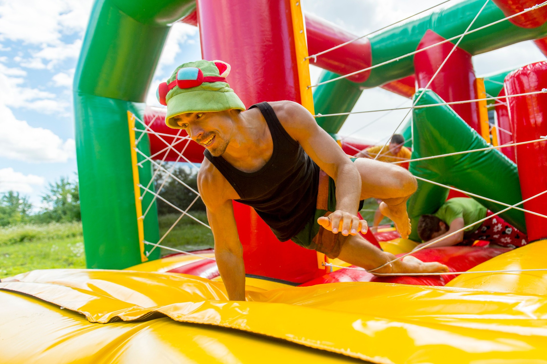 Man Playing On Colorful Bouncy Castle