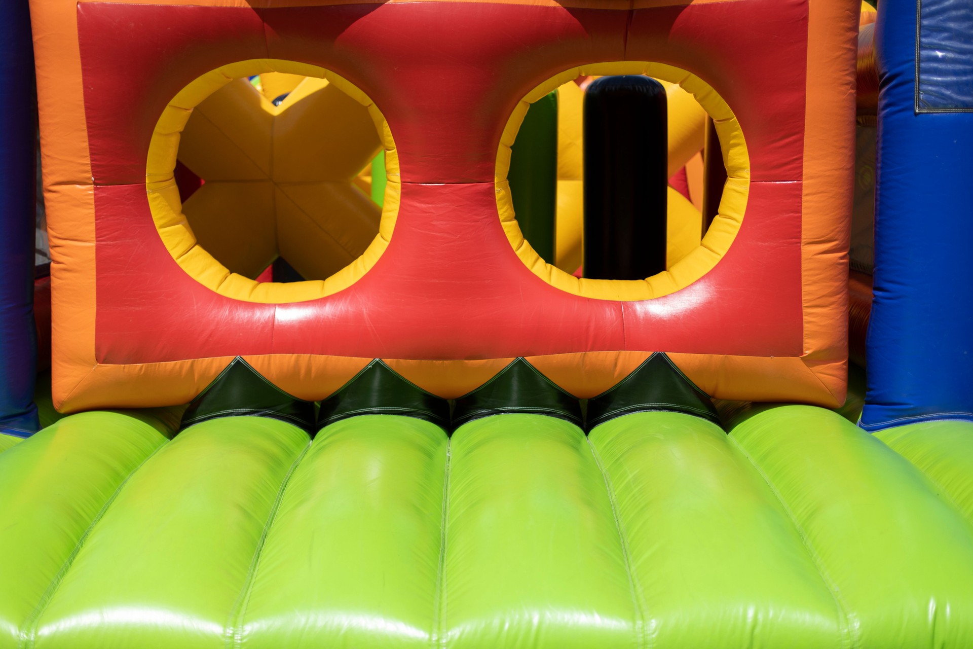 Inflated obstacle course. Rubber trampoline. Entertainment area in summer.